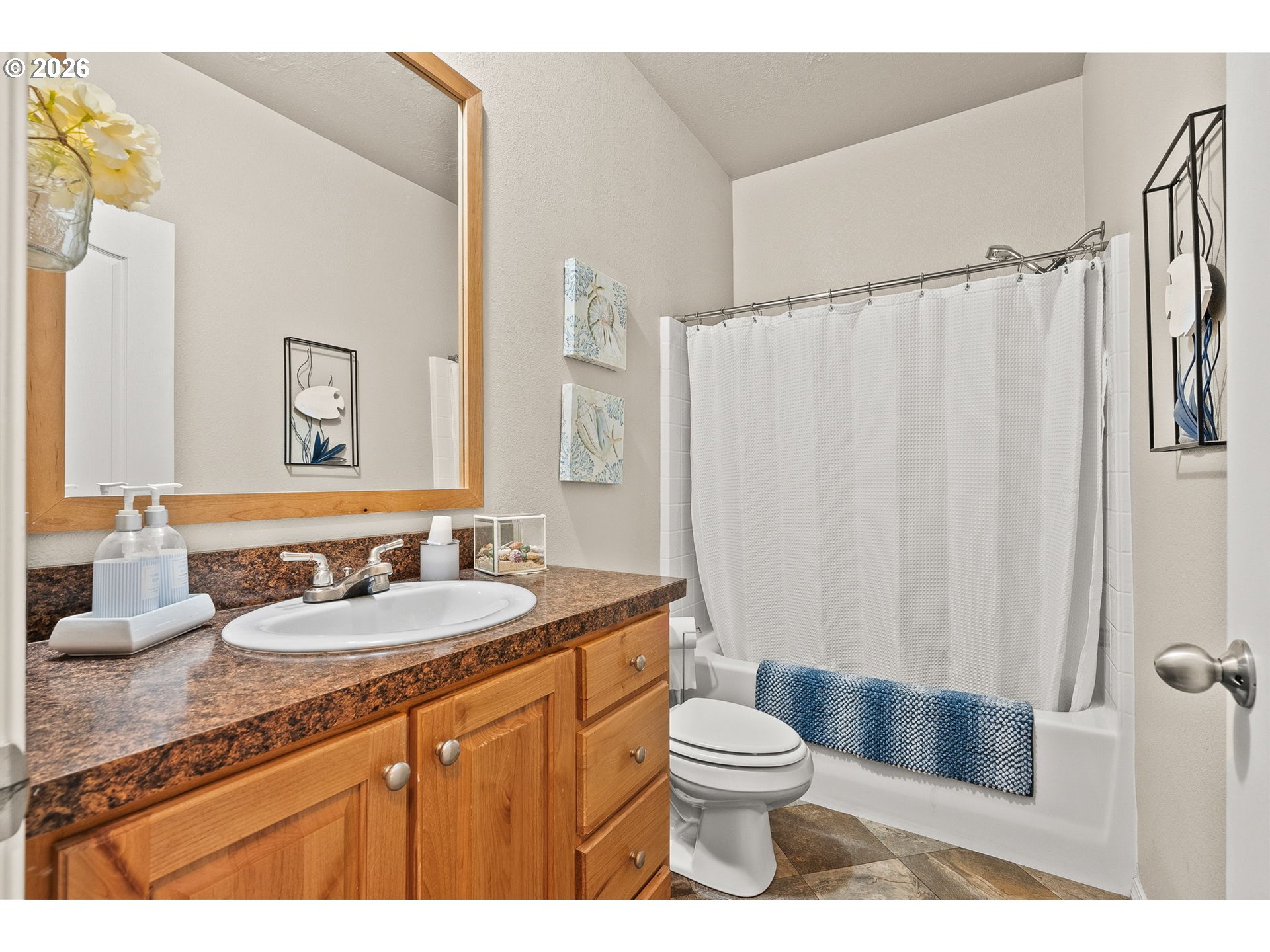 13620 Southwest Beef Bend Road, Unit 1 Portland, OR 97224 - Photo 18 of 34 a bathroom with a granite countertop sink toilet and shower