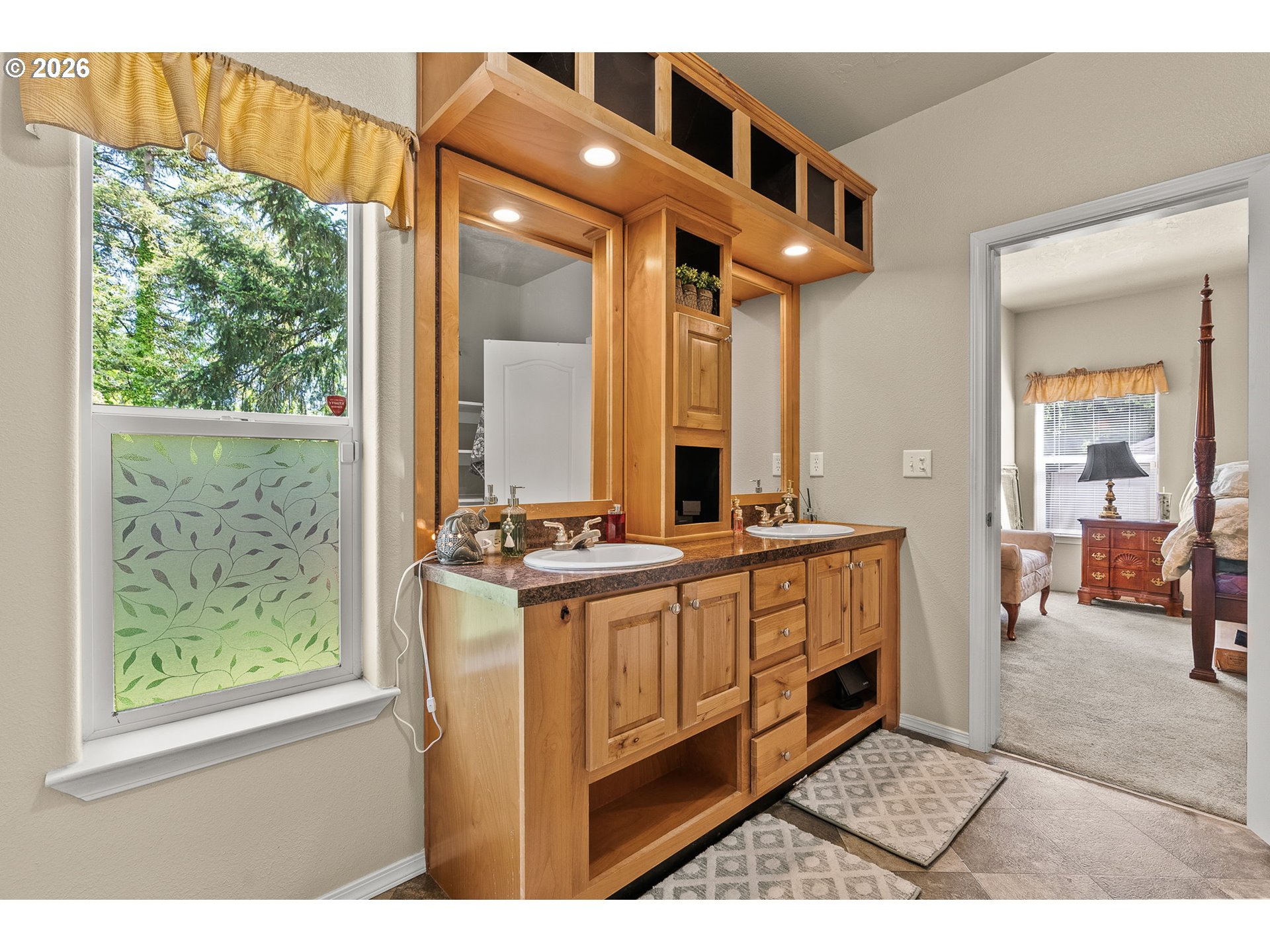 13620 Southwest Beef Bend Road, Unit 1 Portland, OR 97224 - Photo 19 of 34 a bathroom with a double vanity sink and a mirror
