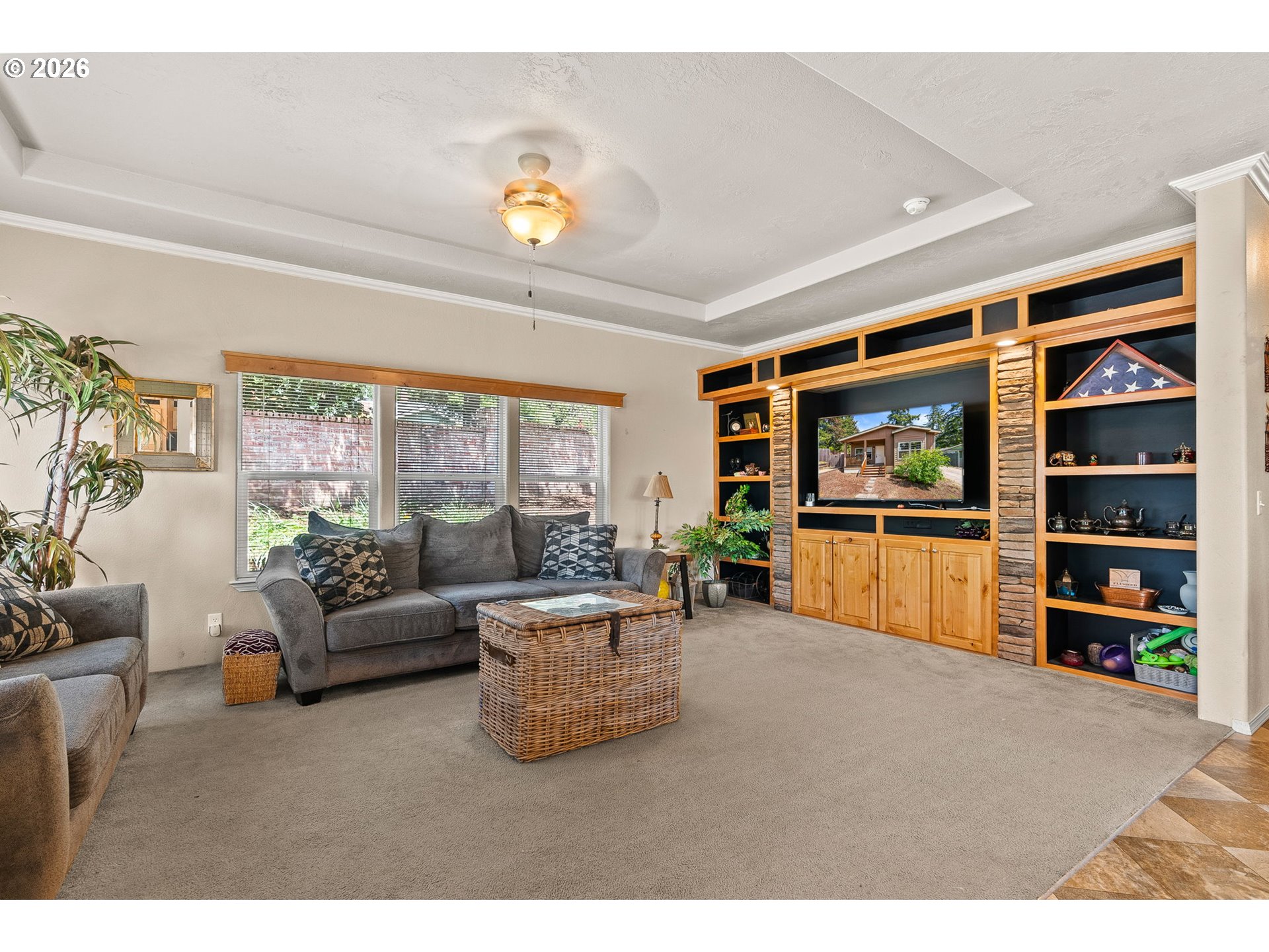 13620 Southwest Beef Bend Road, Unit 1 Portland, OR 97224 - Photo 7 of 34 a living room with furniture and a flat screen tv