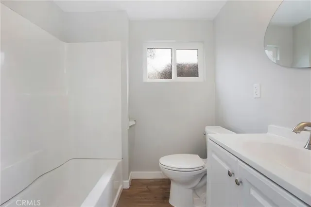 a bathroom with a sink toilet and bathtub