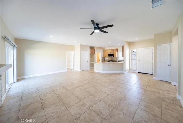 a view of a kitchen with a sink and a window