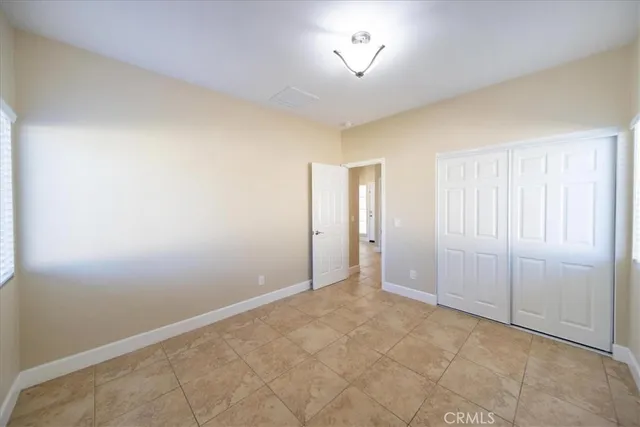 an empty room with a empty space and a window