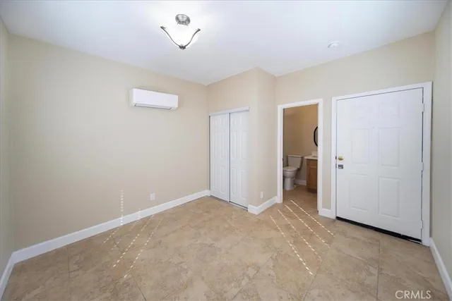 an empty room with a mirror