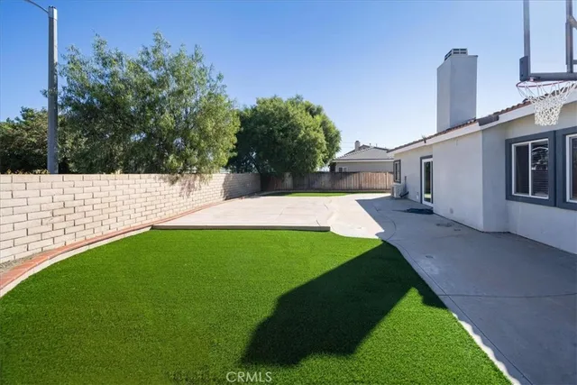 a view of a backyard with potted plants