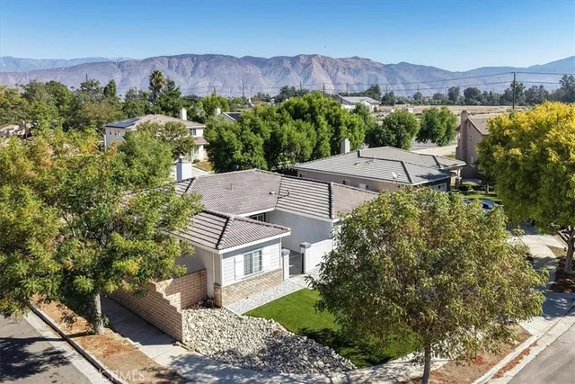 an aerial view of a house with mountain view