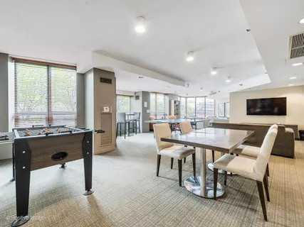 a living room with furniture a flat screen tv and a large window