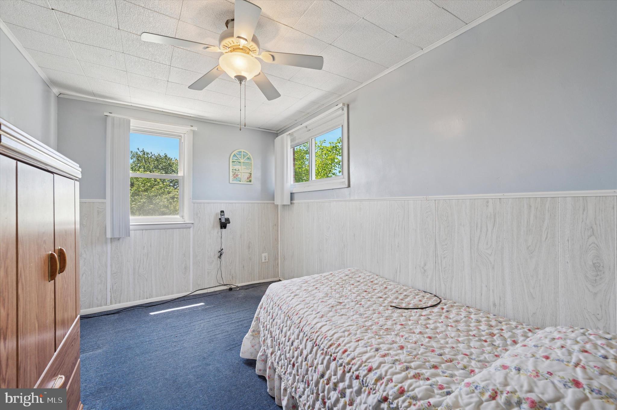 1935 Carter Road Folcroft, PA 19032 - Photo 11 of 15 a bedroom with a bed and a chandelier fan