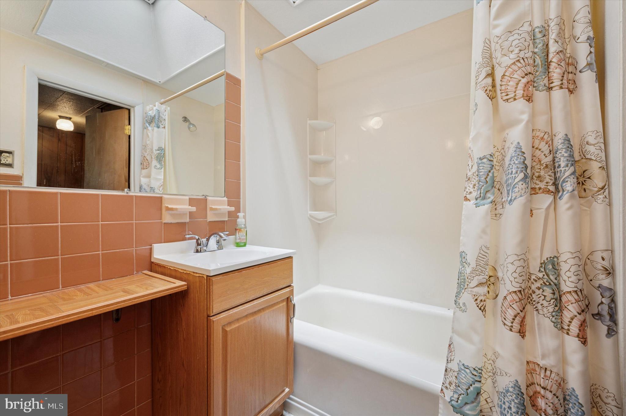 1935 Carter Road Folcroft, PA 19032 - Photo 12 of 15 a bathroom with a sink mirror toilet and bathtub