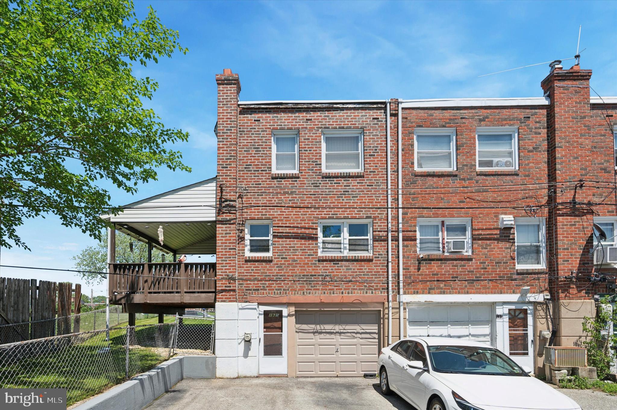 1935 Carter Road Folcroft, PA 19032 - Photo 15 of 15 a view of a brick house with a yard