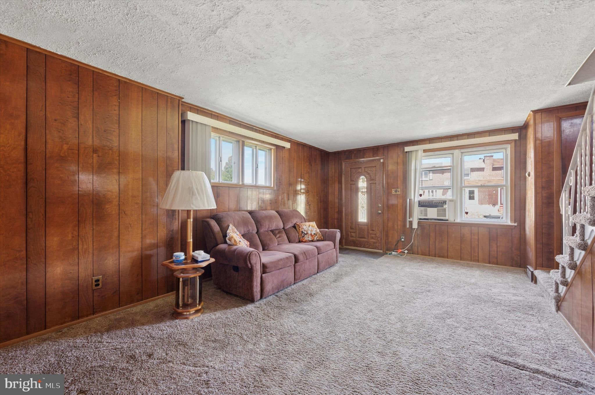 1935 Carter Road Folcroft, PA 19032 - Photo 6 of 15 a living room with furniture a window and a flat screen tv