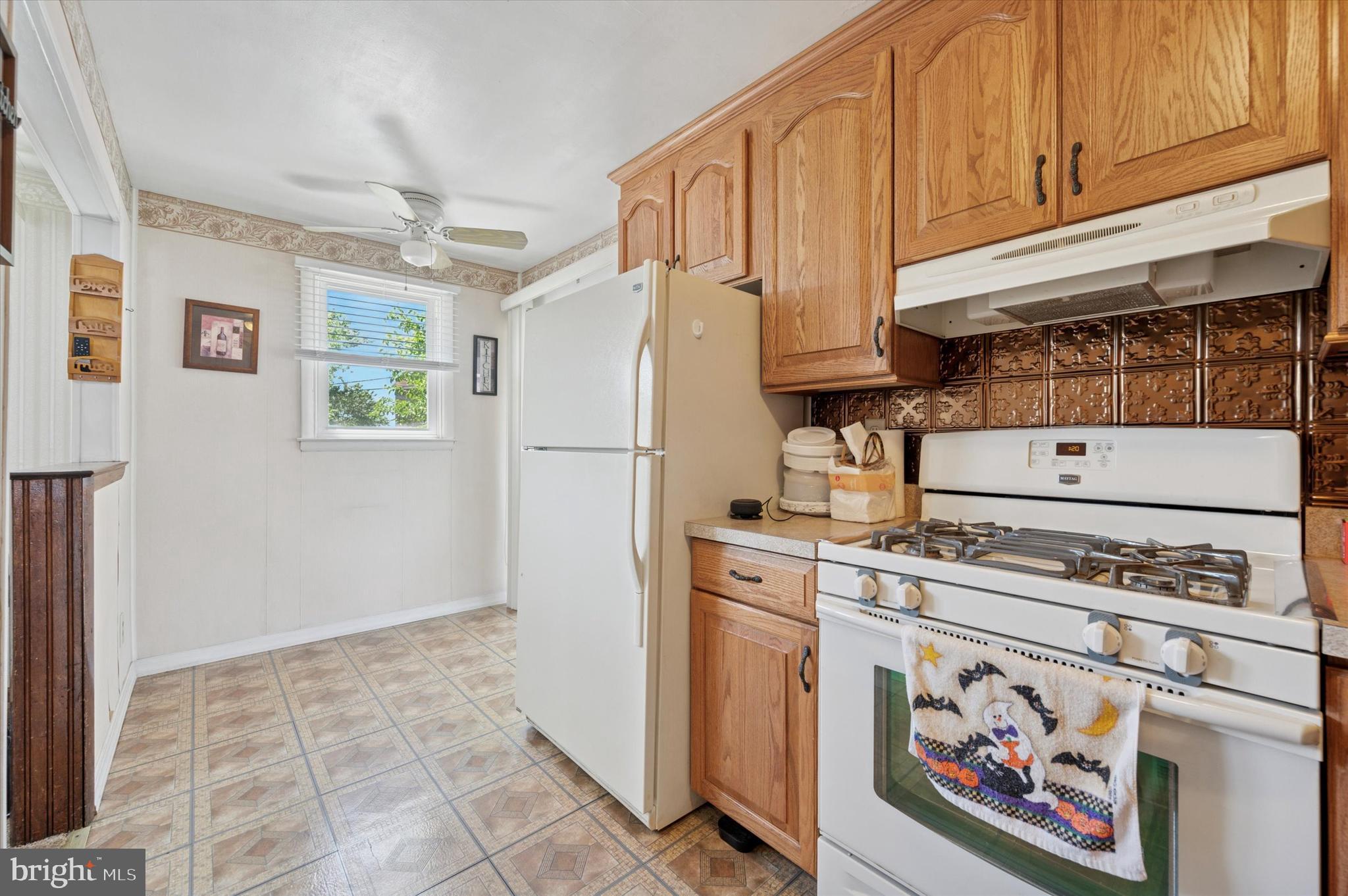 1935 Carter Road Folcroft, PA 19032 - Photo 9 of 15 a kitchen with refrigerator and cabinets