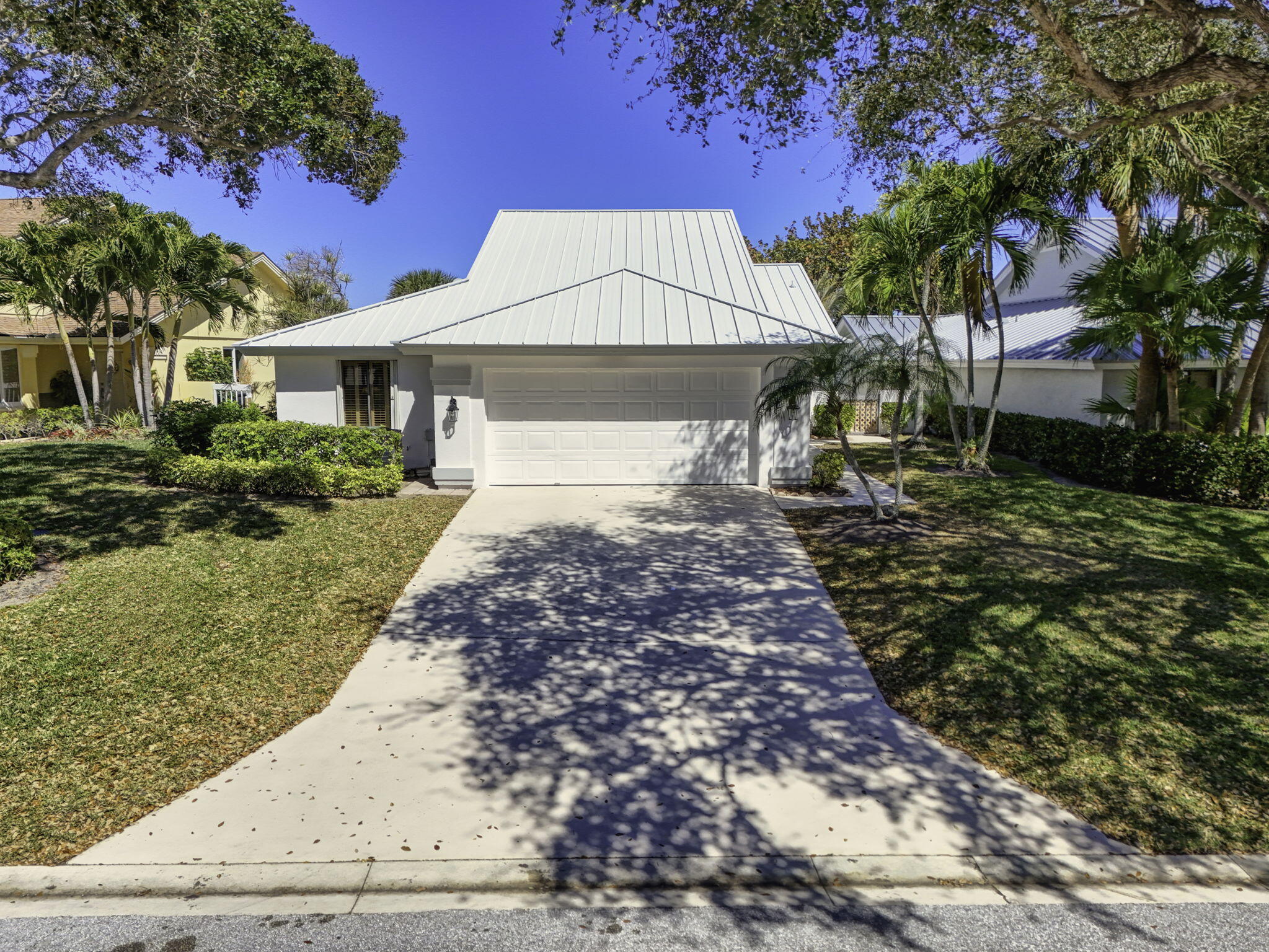239 Ridge Road Jupiter, FL 33477 - Photo 59 of 75 a front view of a house with a yard