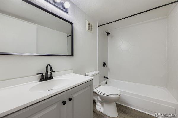 8678 Decatur Street, Unit 275 Westminster, CO 80031 - Photo 19 of 26 a bathroom with a sink a toilet and shower