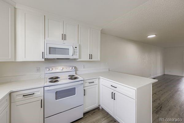 8678 Decatur Street, Unit 275 Westminster, CO 80031 - Photo 10 of 26 a view of white cabinets and sink