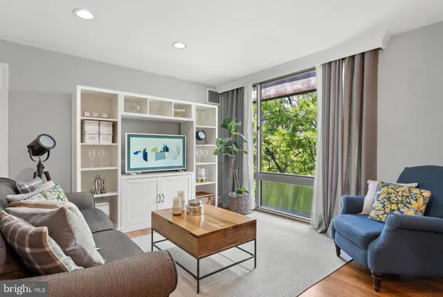 a living room with furniture and a window