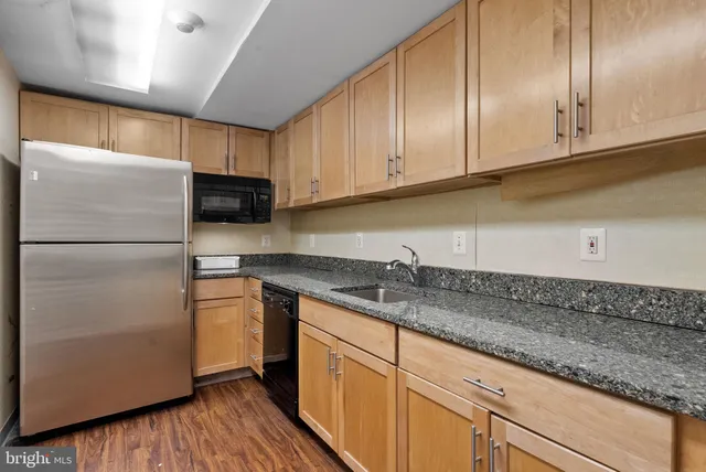 a view of street with stores