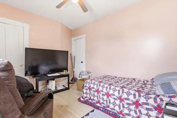 a bedroom with a bed and a table in it