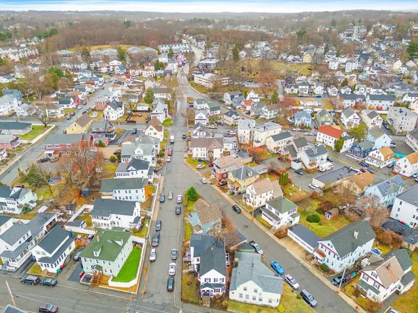 an aerial view of residential building and lake