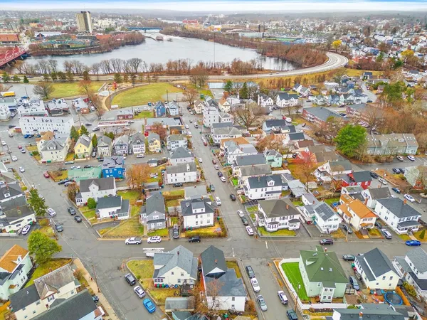 an aerial view of residential building and lake