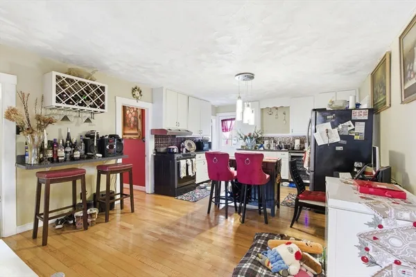 a view of a dining room with furniture and rug
