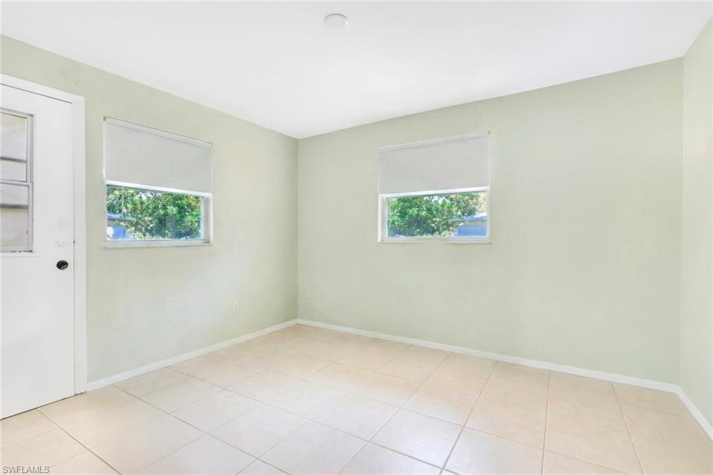 5306 Martin Street Naples, FL 34113 - Photo 23 of 48 an empty room with a window