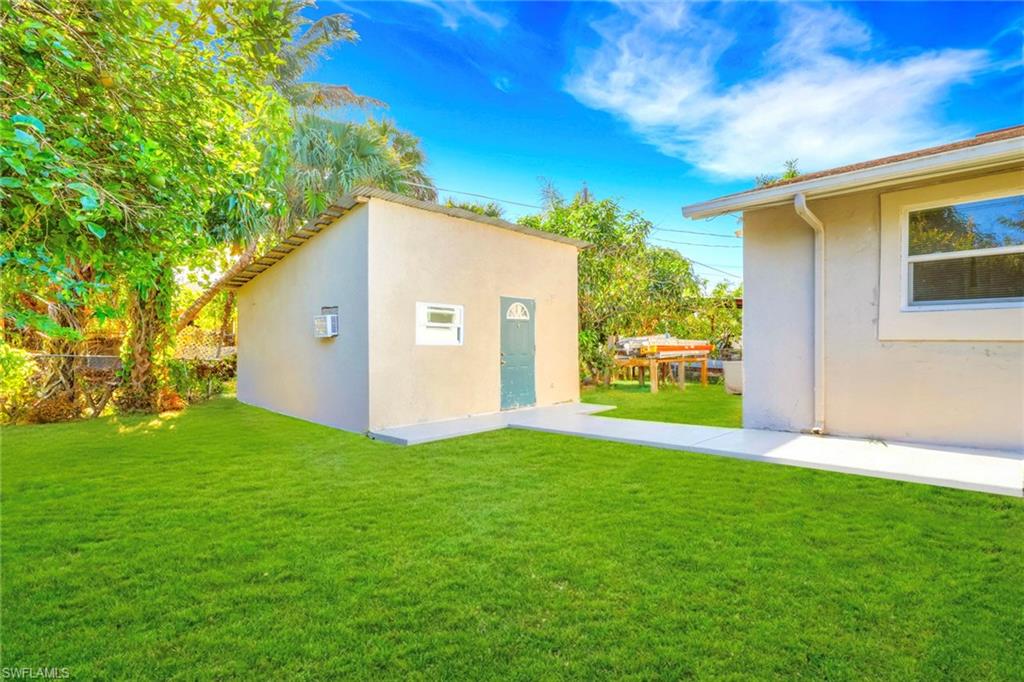5306 Martin Street Naples, FL 34113 - Photo 3 of 48 a view of a back yard of the house