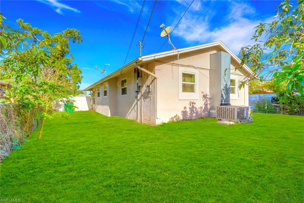5306 Martin Street Naples, FL 34113 - Photo 9 of 48 a view of a back yard of the house