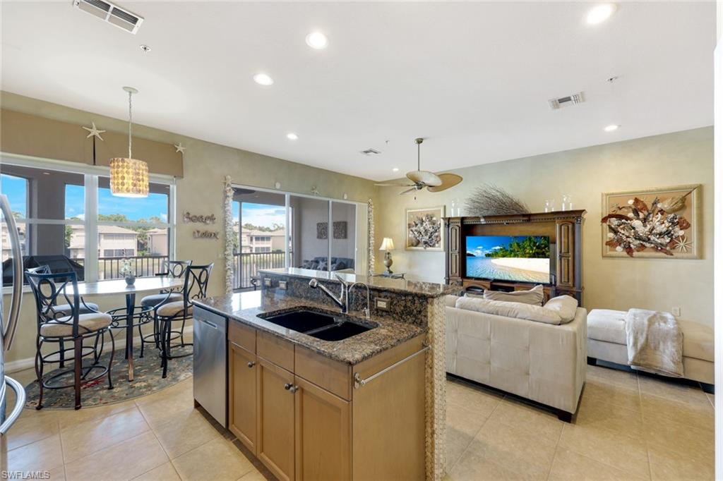 3530 Lansing Loop, Unit 202 Estero, FL 33928 - Photo 16 of 35 a living room with furniture and a flat screen tv