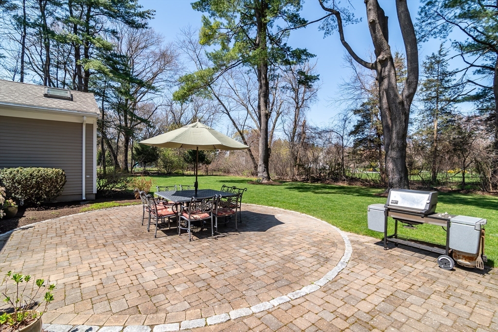 116 Stock Farm Road Sudbury, MA 01776 - Photo 23 of 31 a view of a backyard with sitting area