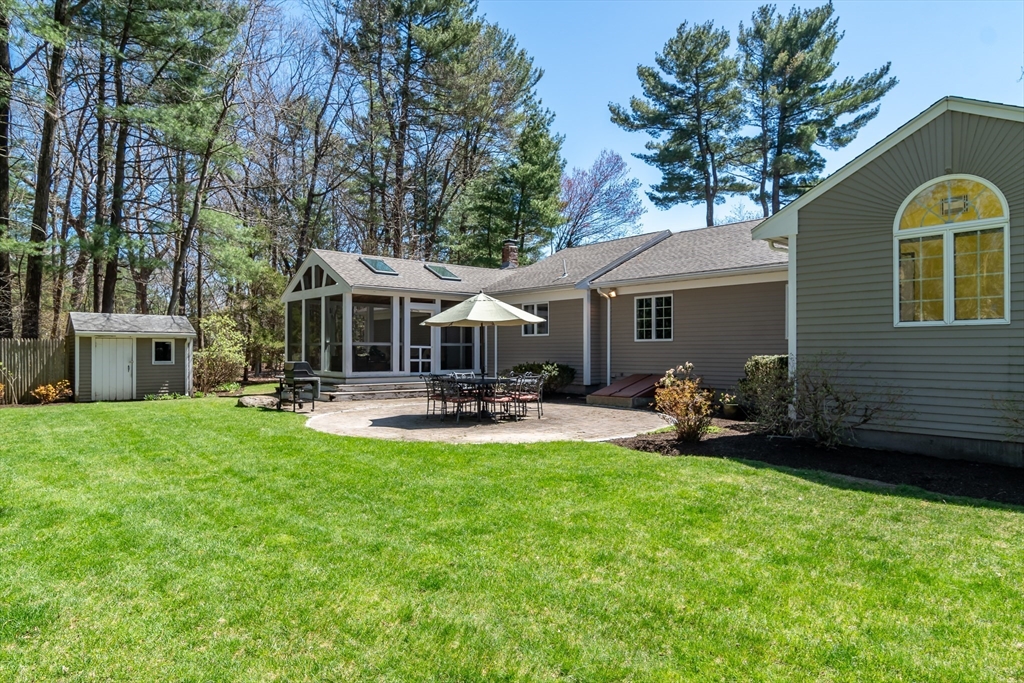 116 Stock Farm Road Sudbury, MA 01776 - Photo 24 of 31 a front view of a house with patio and garden