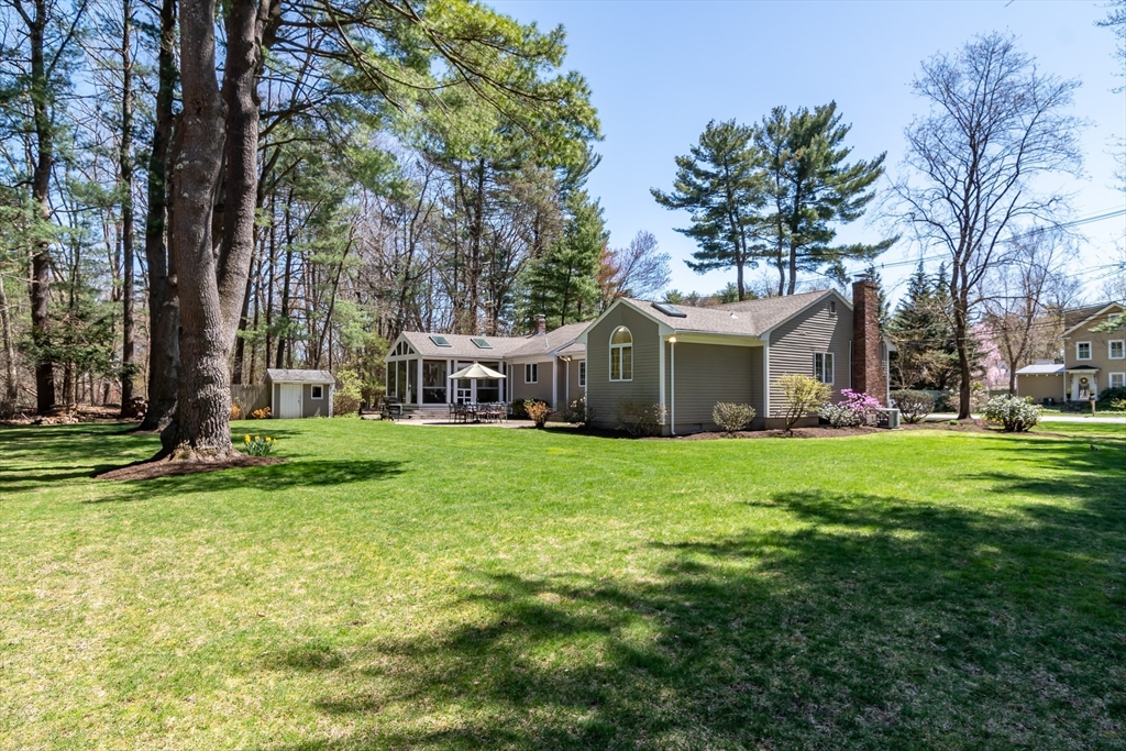 116 Stock Farm Road Sudbury, MA 01776 - Photo 25 of 31 a front view of house with yard and green space