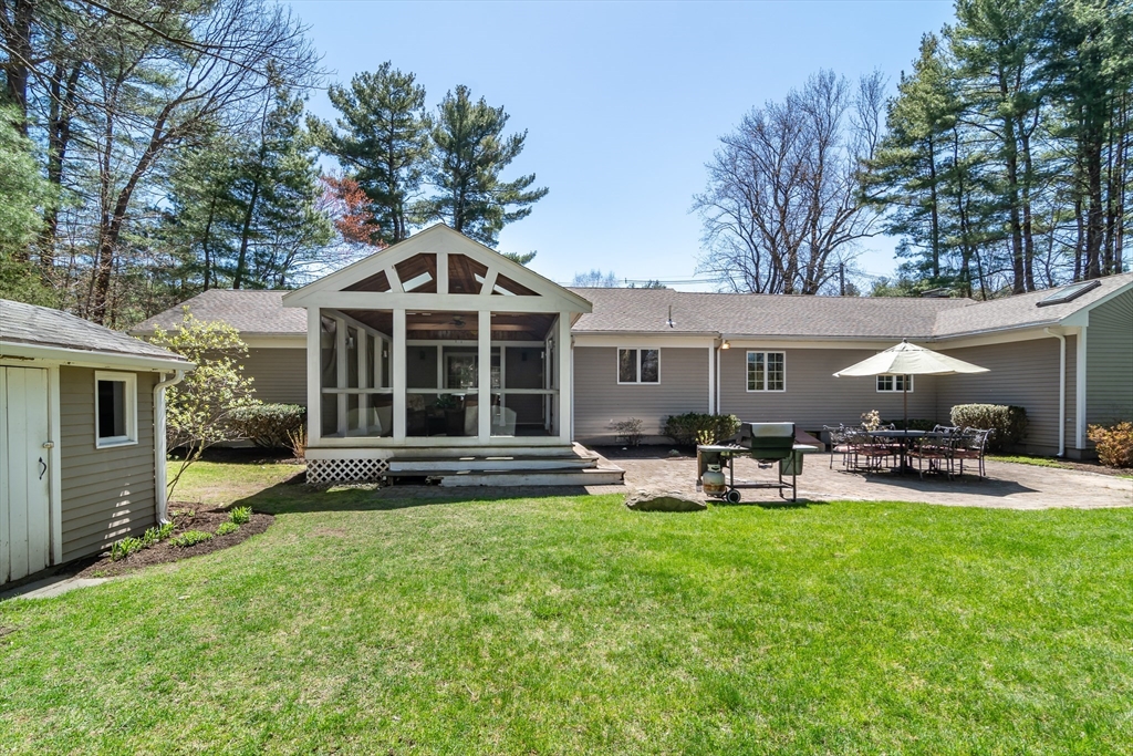 116 Stock Farm Road Sudbury, MA 01776 - Photo 26 of 31 a view of a house with a yard and sitting area