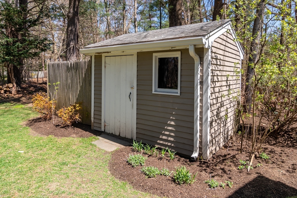 116 Stock Farm Road Sudbury, MA 01776 - Photo 27 of 31 a view of a house with a yard and garage