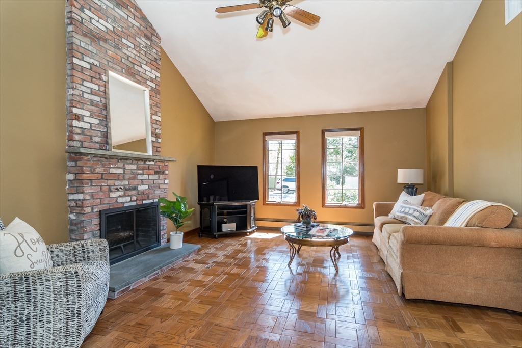 116 Stock Farm Road Sudbury, MA 01776 - Photo 4 of 31 a living room with furniture and a fireplace