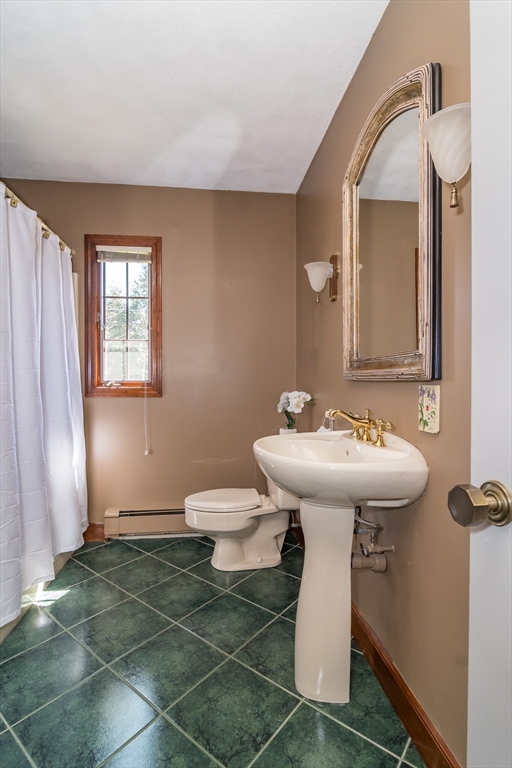 116 Stock Farm Road Sudbury, MA 01776 - Photo 7 of 31 a bathroom with a sink toilet and mirror