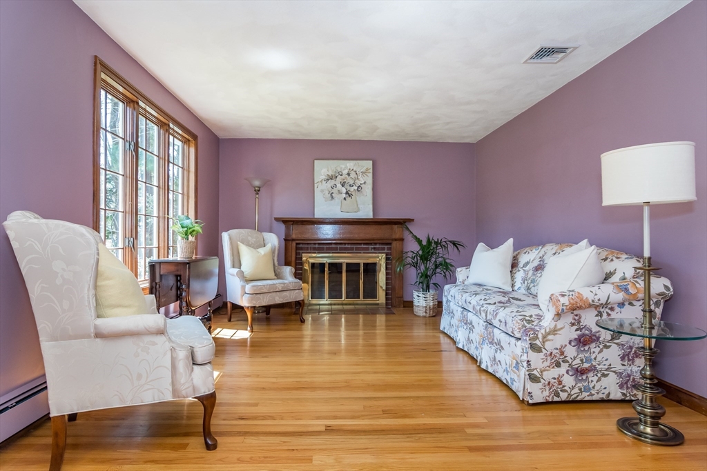 116 Stock Farm Road Sudbury, MA 01776 - Photo 10 of 31 a living room with furniture large window and wooden floor