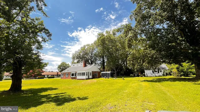 a view of a swimming pool with an outdoor space and seating area