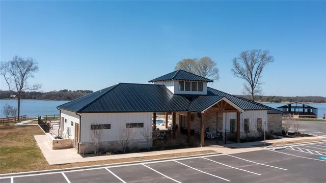 a patio with a table and chairs under an umbrella