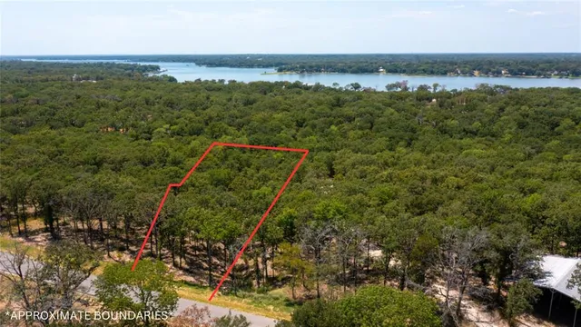 a street sign is sitting on a sidewalk