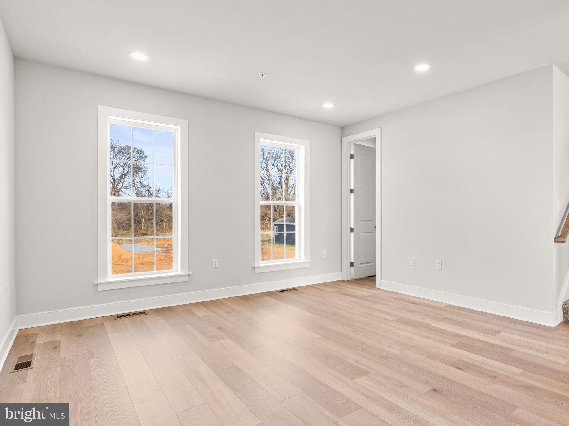 3 Sage Street Carlisle, PA 17015 - Photo 14 of 41 a view of an empty room with wooden floor and a window