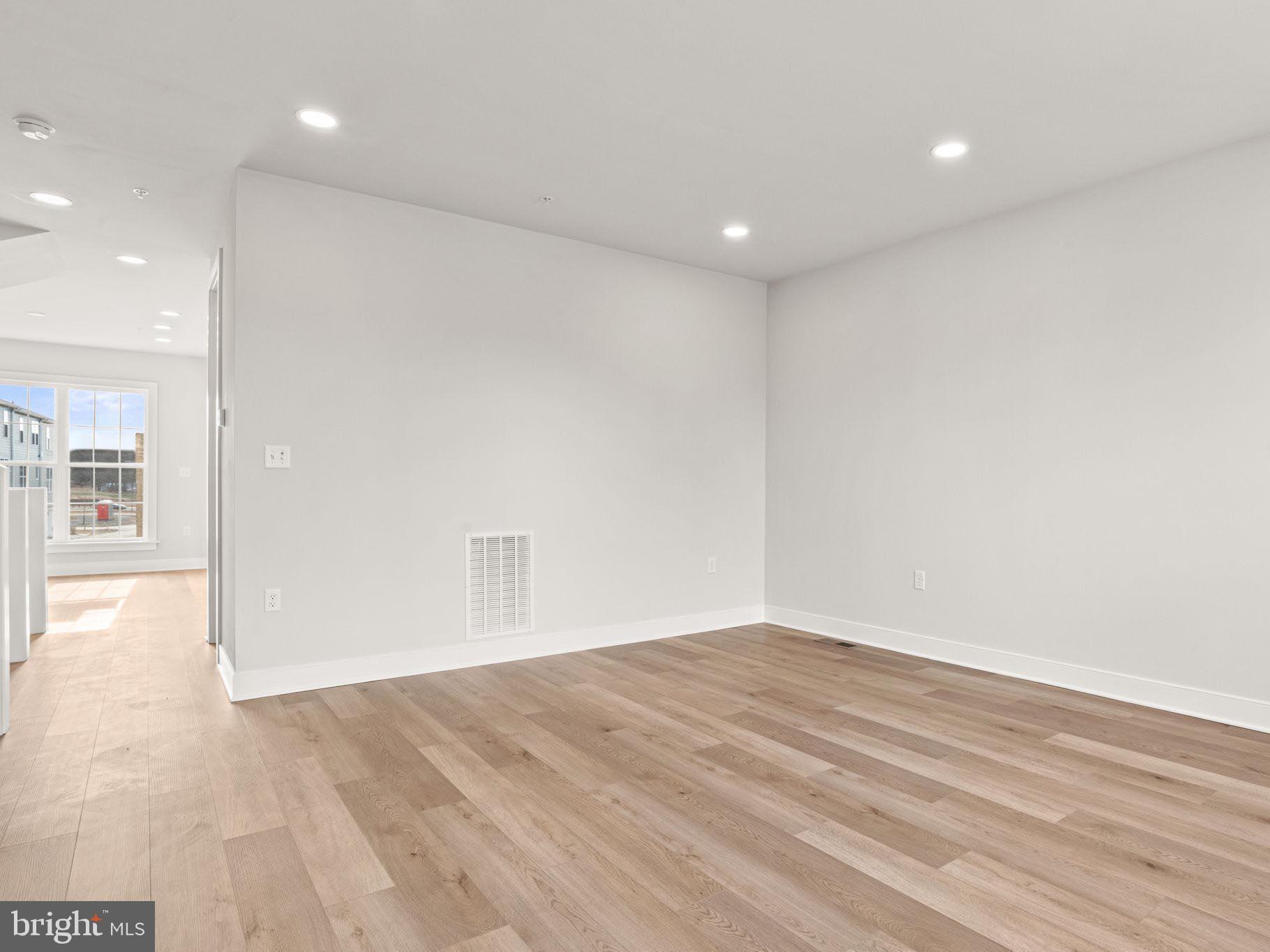 3 Sage Street Carlisle, PA 17015 - Photo 17 of 41 an empty room with wooden floor and windows