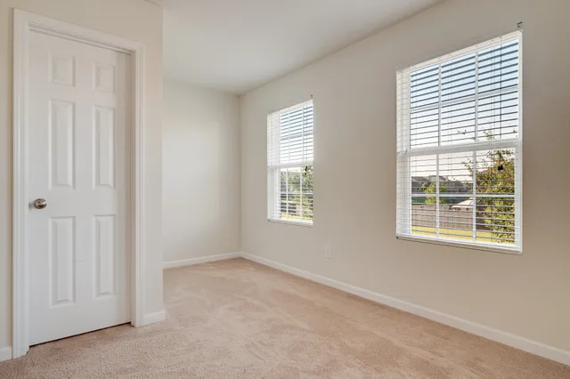 a view of a room that has a window in it