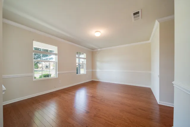 a kitchen with stainless steel appliances granite countertop a refrigerator and a stove