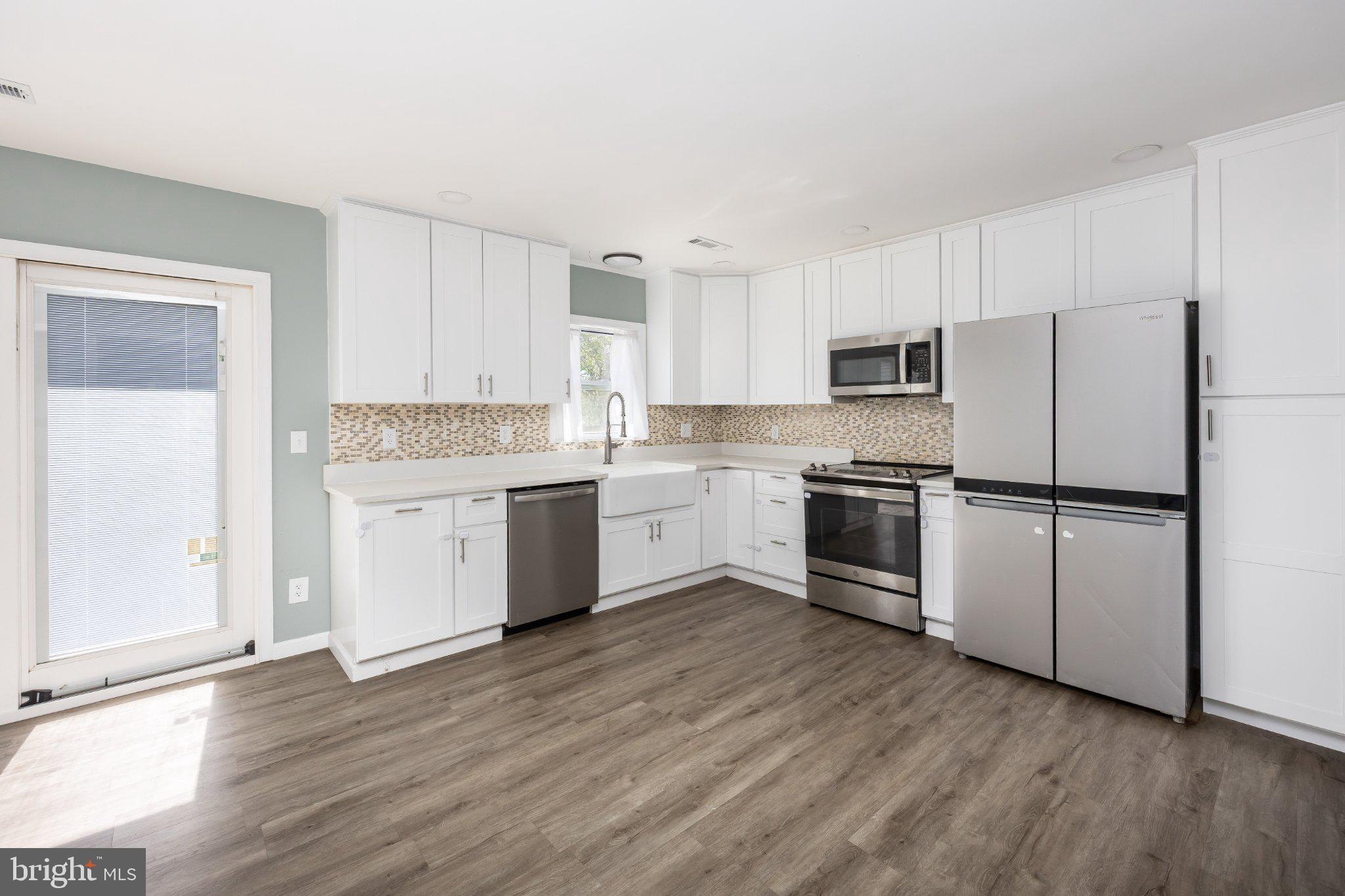30797 Dagsboro Road Salisbury, MD 21804 - Photo 15 of 58 Modern kitchen with sleek finishes.