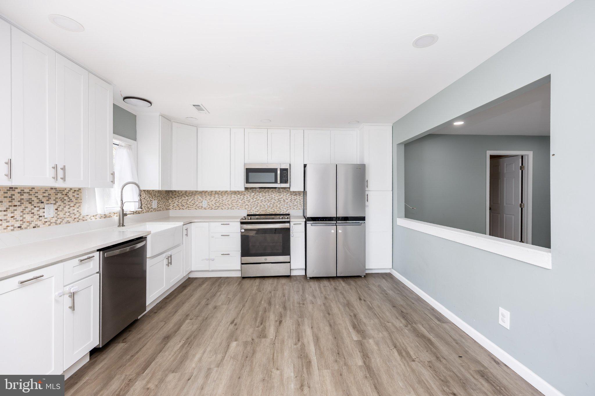 30797 Dagsboro Road Salisbury, MD 21804 - Photo 16 of 58 Modern kitchen with sleek finishes.