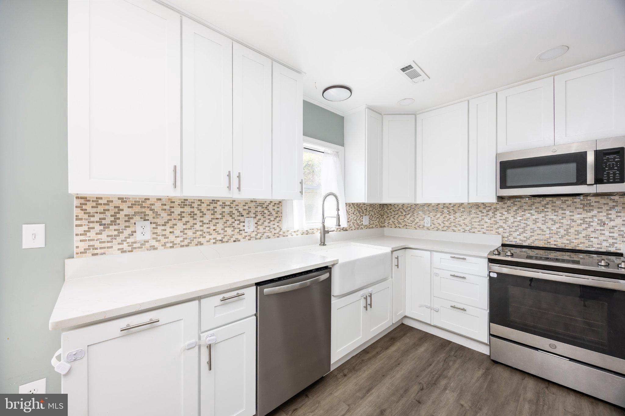 30797 Dagsboro Road Salisbury, MD 21804 - Photo 17 of 58 Modern kitchen with sleek finishes.