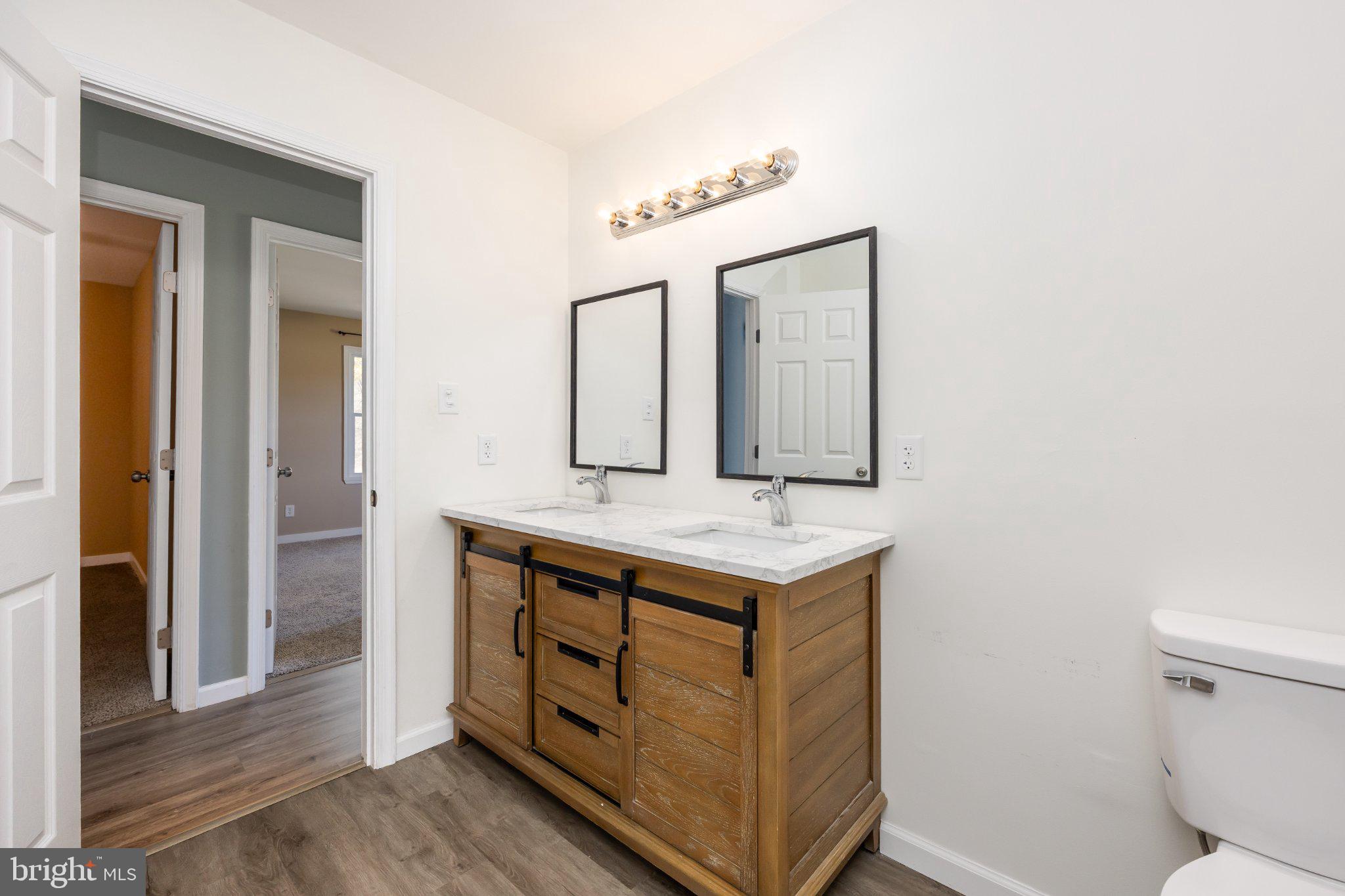 30797 Dagsboro Road Salisbury, MD 21804 - Photo 27 of 58 Modern dual-sink bathroom oasis.