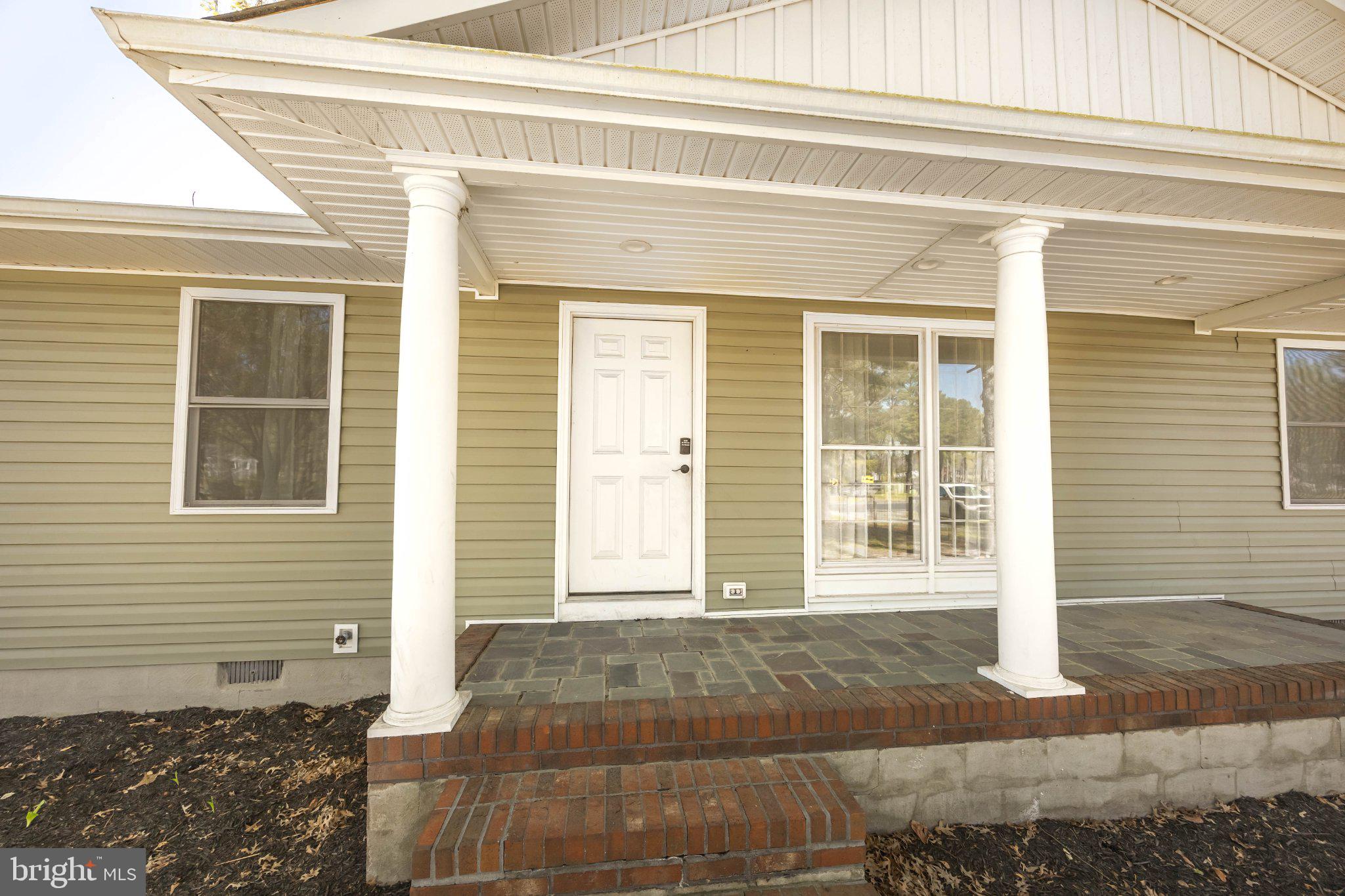 30797 Dagsboro Road Salisbury, MD 21804 - Photo 9 of 58 Charming entryway with classic columns.
