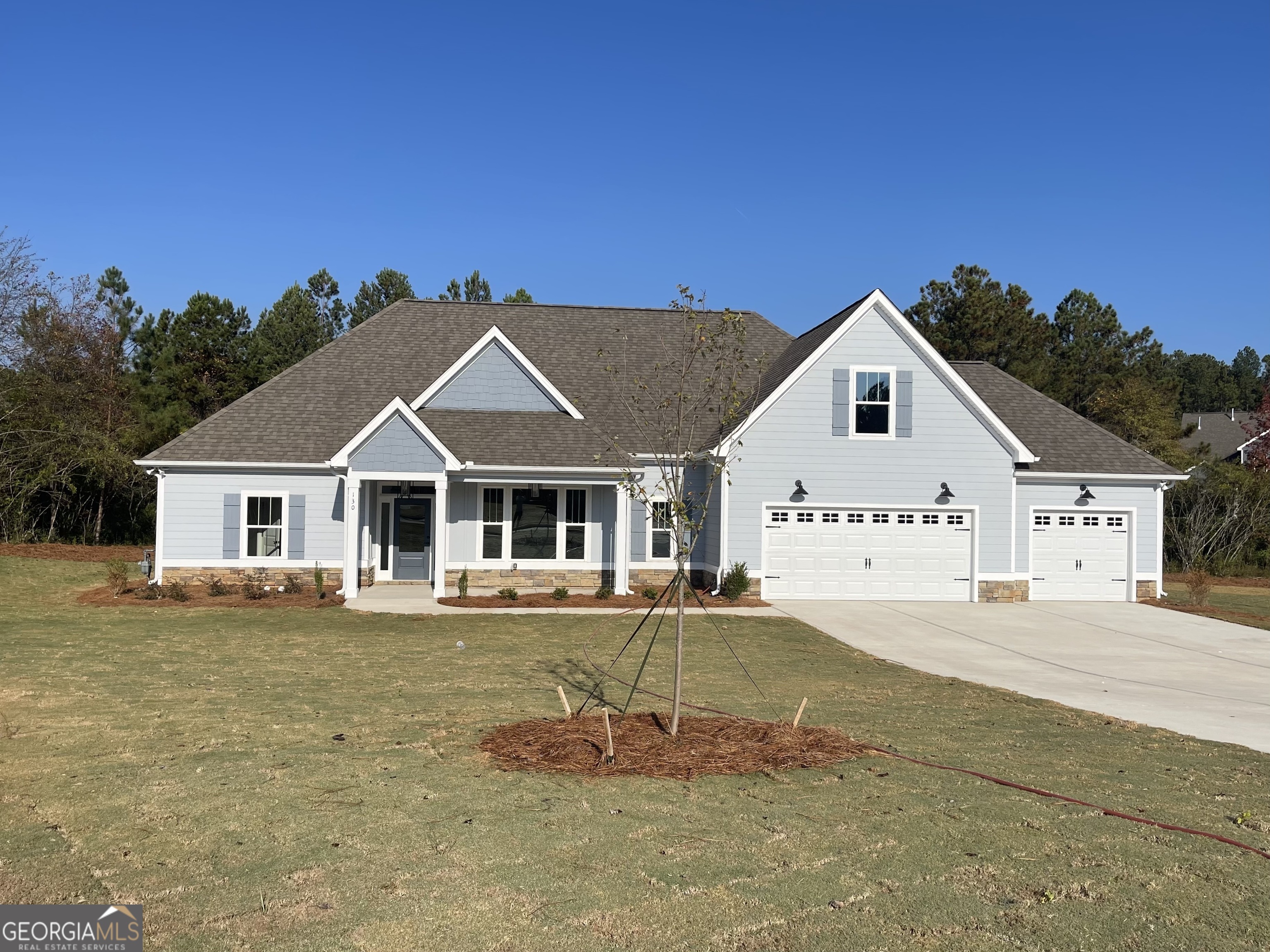 130 Rutland Court Senoia, GA 30276 - Photo 1 of 1 a front view of a house with a yard