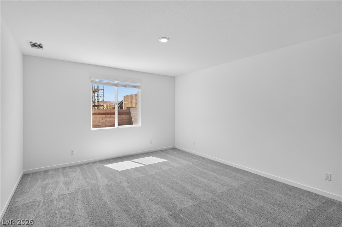 347 Sam Way Mesquite, NV 89027 - Photo 18 of 32 A well-lit bedroom provides a blank canvas for personalization with neutral tones.